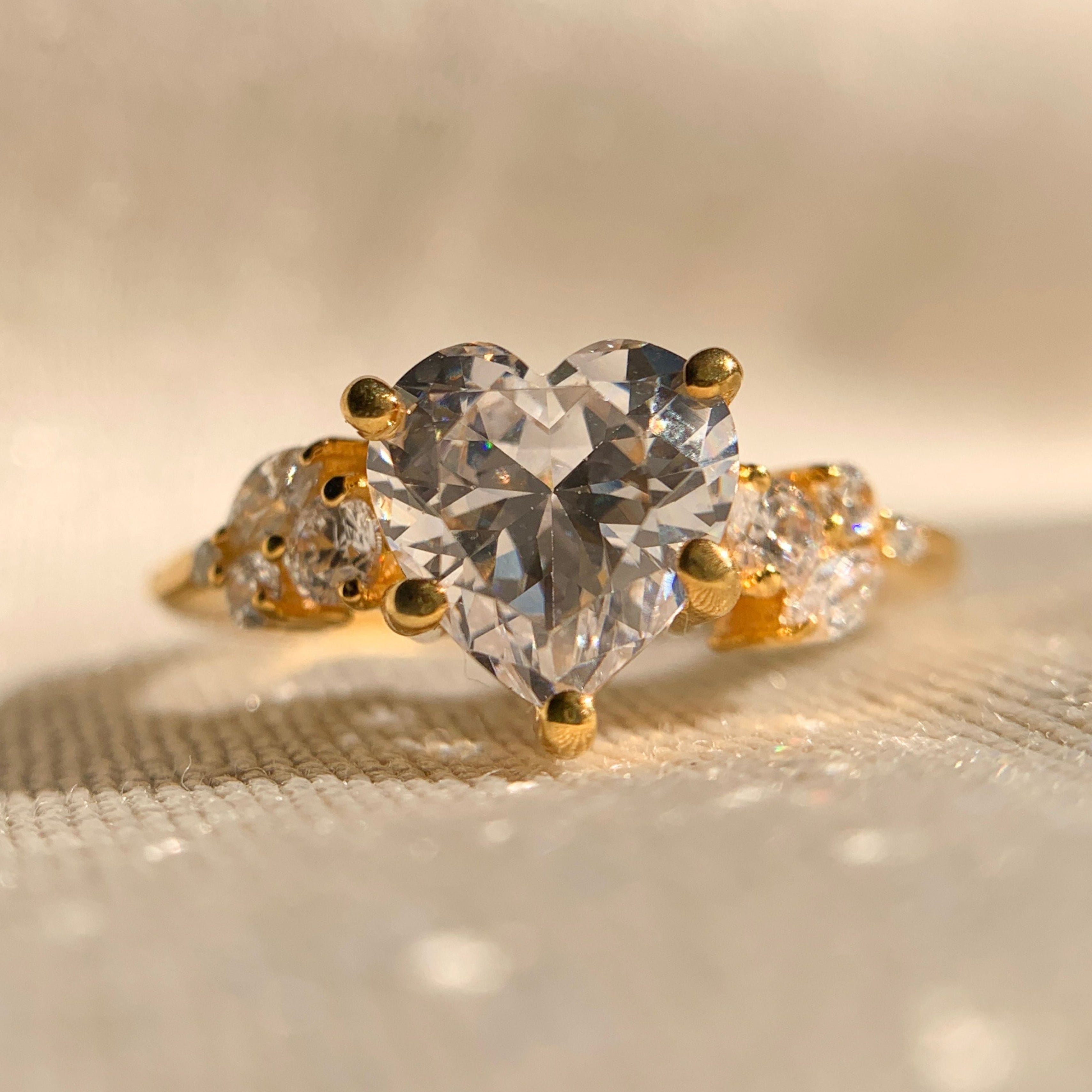 Heart cut diamond engagement ring with sparkling side accents in white gold